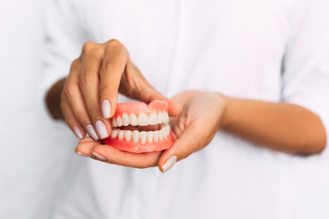 Rider Family Dentistry Dentist in Cherokee, IA The,Dentist,Is,Holding,Dentures,In,His,Hands.,Dental,Prosthesis